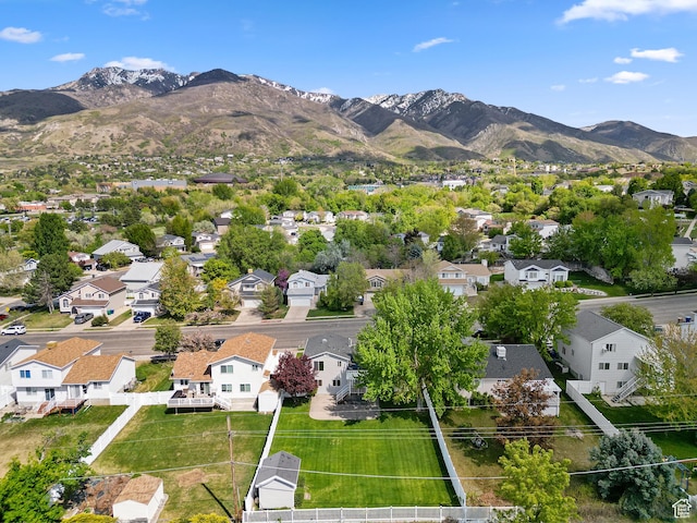aerial view of residential area featuring mountains