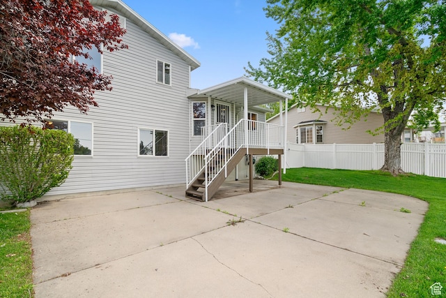 rear view of property featuring a patio