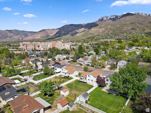 aerial view of residential area featuring a mountainous background