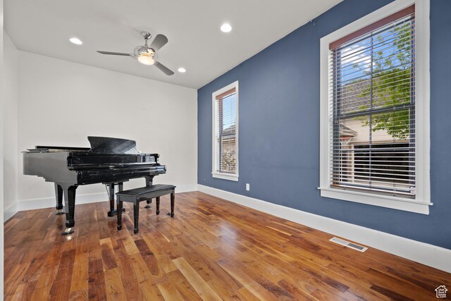sitting room featuring wood finished floors, baseboards, a ceiling fan, and recessed lighting