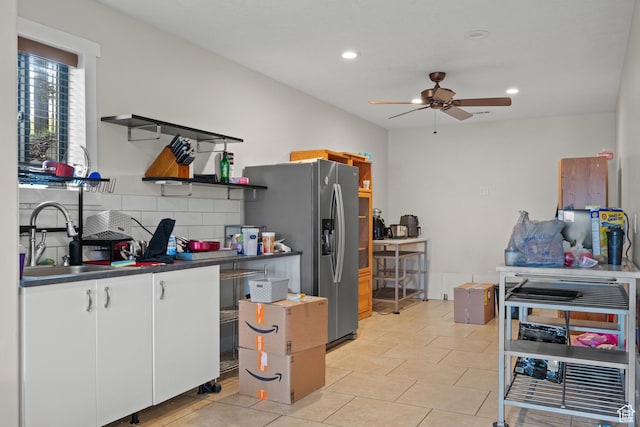 kitchen featuring open shelves, a sink, dark countertops, ceiling fan, and white cabinets