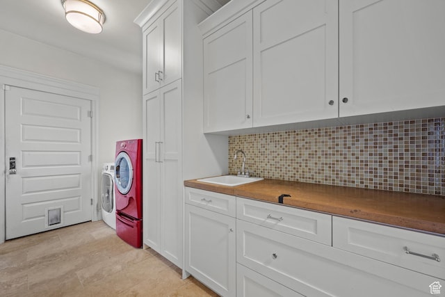 laundry room featuring cabinet space and washing machine and dryer