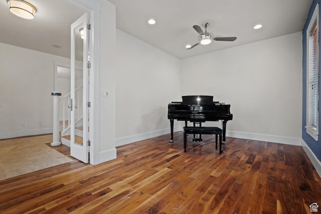 living area with a ceiling fan, hardwood / wood-style floors, baseboards, and recessed lighting