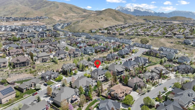 aerial overview of property's location with nearby suburban area and a mountain backdrop