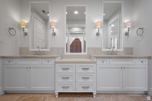 full bath featuring two vanities
