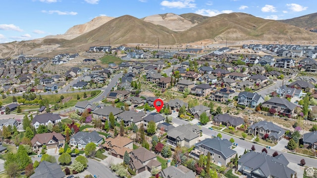 aerial view of property and surrounding area with nearby suburban area and mountains