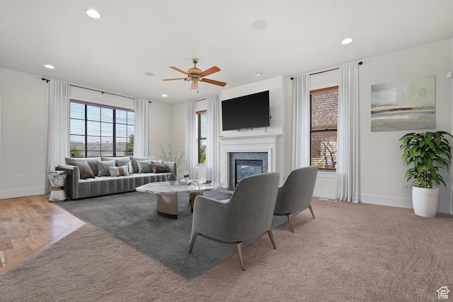 5047 N Larkwood Ln, Lehi, UT 84043 - living room with a ceiling fan, a glass covered fireplace, carpet, and recessed lighting