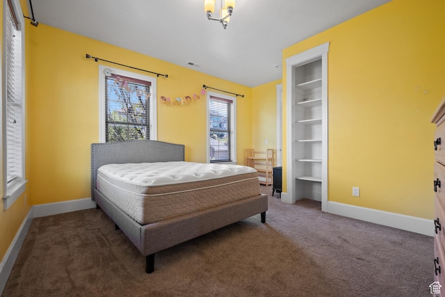 bedroom with carpet and baseboards