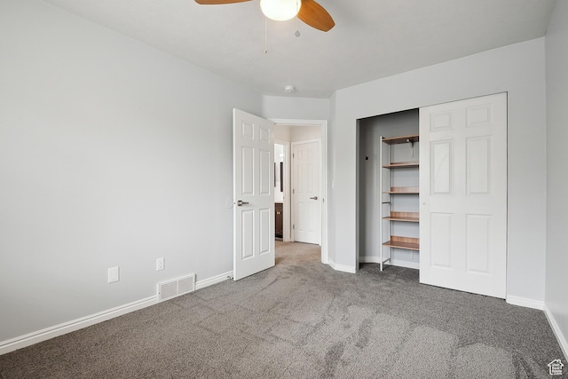 unfurnished bedroom with carpet flooring, baseboards, ceiling fan, and a closet