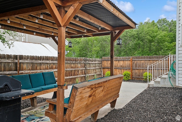 view of patio with an outdoor living space and a fenced backyard