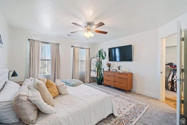 6303 S Zelda Dr, St George, UT 84790 - bedroom featuring light colored carpet, a ceiling fan, and baseboards