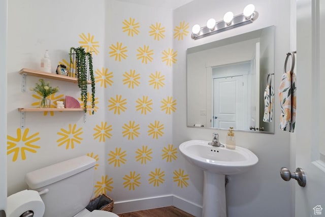 6303 S Zelda Dr, St George, UT 84790 - half bath featuring toilet, baseboards, and wood finished floors