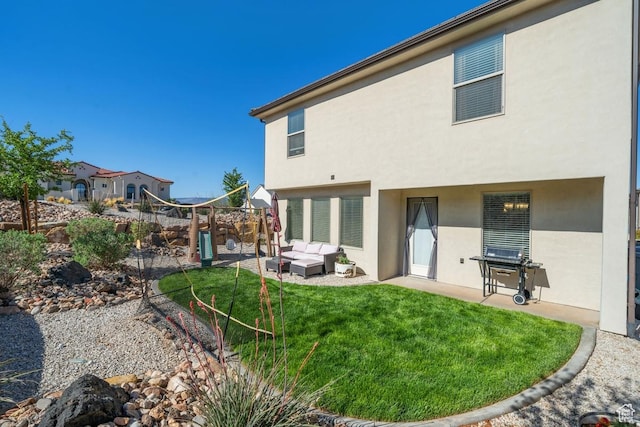 6303 S Zelda Dr, St George, UT 84790 - back of house with a patio, stucco siding, outdoor lounge area, and a lawn