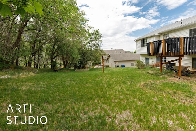 view of yard featuring a wooden deck