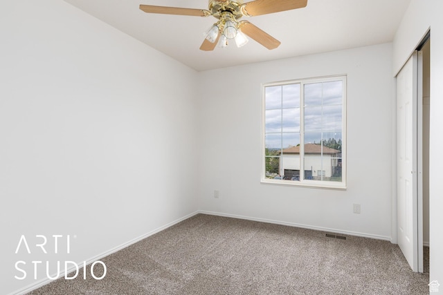 unfurnished bedroom with carpet floors, baseboards, a ceiling fan, and a closet