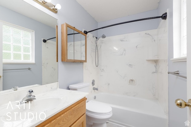 bathroom featuring toilet, vanity, and shower / bath combination
