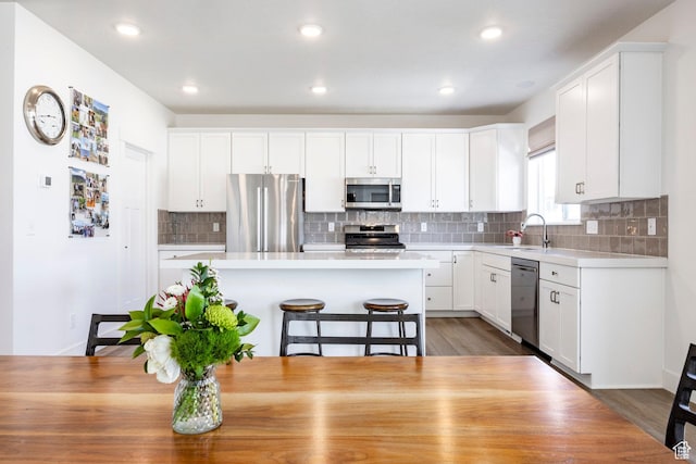 1401 S 1040 E, Heber City, UT 84032 - kitchen with stainless steel appliances, a sink, light countertops, white cabinetry, and recessed lighting