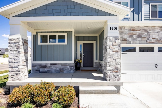 1401 S 1040 E, Heber City, UT 84032 - doorway to property with board and batten siding, a porch, stone siding, and a garage