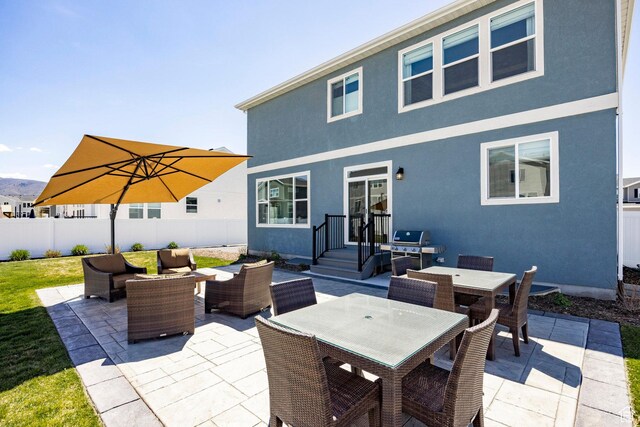 1401 S 1040 E, Heber City, UT 84032 - rear view of property featuring an outdoor living space, a patio, fence, outdoor dining space, and stucco siding