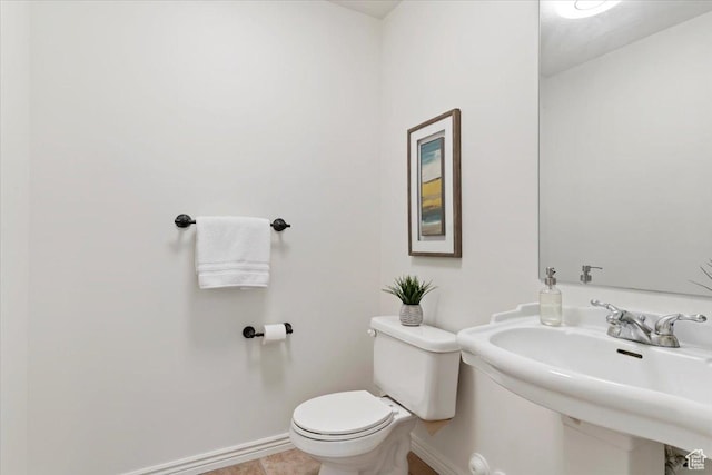 155 W 1525 N, Layton, UT 84041 - bathroom featuring baseboards, toilet, and a sink