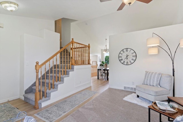 155 W 1525 N, Layton, UT 84041 - living room featuring stairs, a ceiling fan, high vaulted ceiling, baseboards, and wood finished floors