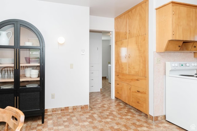 entryway featuring light flooring and baseboards