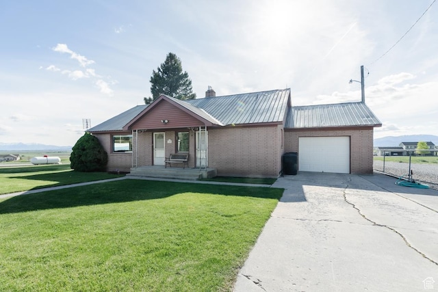 ranch-style house with an attached garage, concrete driveway, brick siding, metal roof, and covered porch