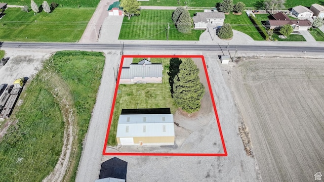 aerial view of property and surrounding area with property parcel outlined
