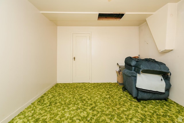 unfurnished room with carpet flooring and baseboards