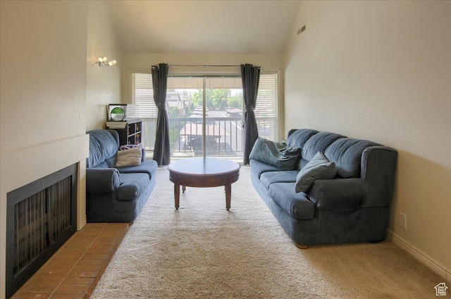 1091 Country Hills Dr Unit 306, Ogden, UT 84403 - living area with carpet floors, high vaulted ceiling, and a fireplace with flush hearth