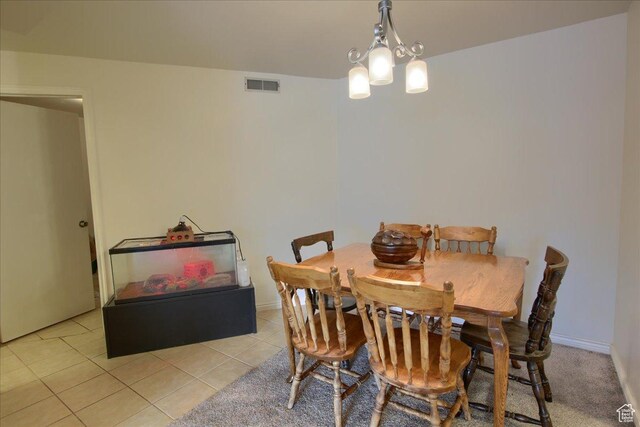 1091 Country Hills Dr Unit 306, Ogden, UT 84403 - dining area with a chandelier and light tile patterned flooring