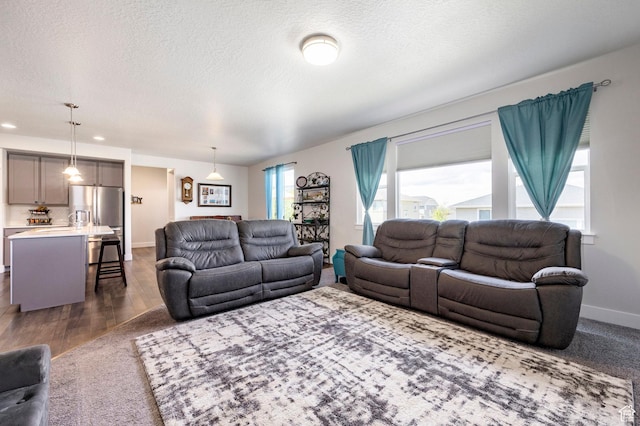 4468 W Meadow Bend Dr S, Herriman, UT 84096 - living room with a textured ceiling, dark wood-style floors, baseboards, and recessed lighting