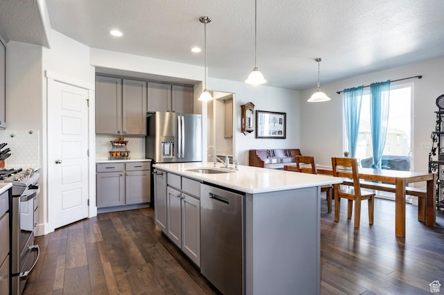 4468 W Meadow Bend Dr S, Herriman, UT 84096 - kitchen featuring gray cabinets, stainless steel appliances, a sink, dark wood-style floors, and recessed lighting