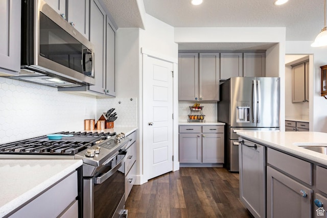 4468 W Meadow Bend Dr S, Herriman, UT 84096 - kitchen with stainless steel appliances, gray cabinetry, and recessed lighting