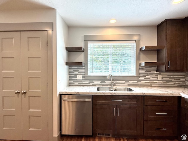 kitchen with open shelves, dishwasher, a sink, dark brown cabinets, and a textured ceiling