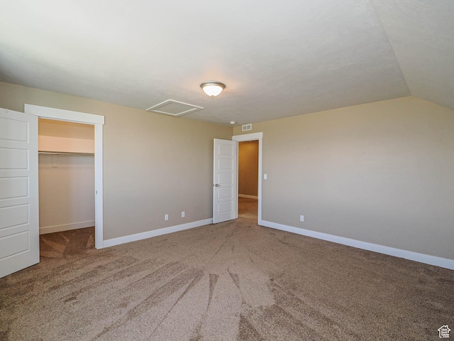 7503 S Bridge Maple Ln, West Jordan, UT 84081 - unfurnished bedroom featuring carpet, a spacious closet, baseboards, attic access, and vaulted ceiling
