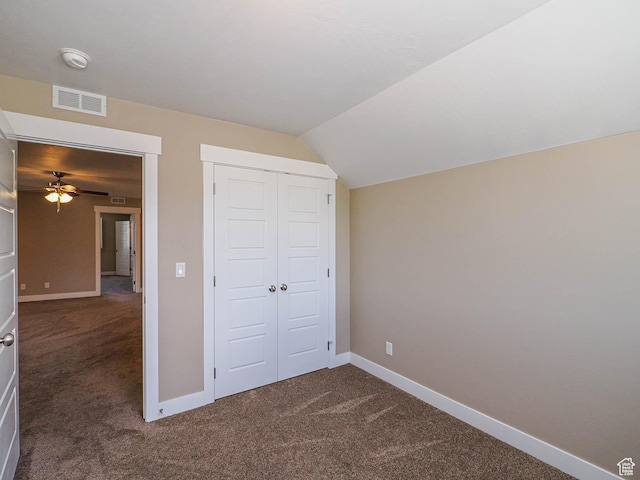 7503 S Bridge Maple Ln, West Jordan, UT 84081 - unfurnished bedroom with dark colored carpet, baseboards, a closet, and vaulted ceiling