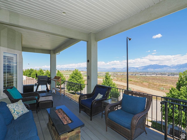 7503 S Bridge Maple Ln, West Jordan, UT 84081 - wooden terrace featuring an outdoor living space with a fire pit and a mountain view