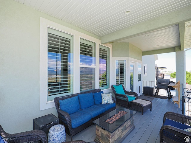 7503 S Bridge Maple Ln, West Jordan, UT 84081 - deck with an outdoor living space with a fire pit and a grill