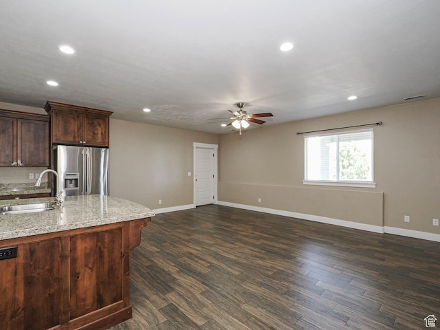 7503 S Bridge Maple Ln, West Jordan, UT 84081 - kitchen with stainless steel fridge with ice dispenser, a sink, a ceiling fan, recessed lighting, and baseboards
