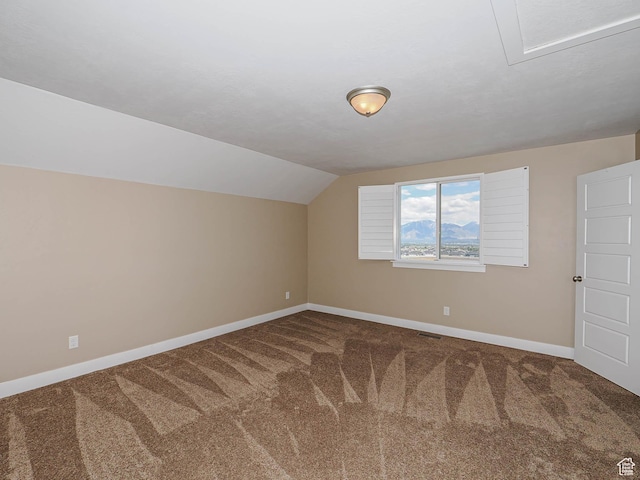 7503 S Bridge Maple Ln, West Jordan, UT 84081 - bonus room featuring carpet floors, baseboards, and vaulted ceiling