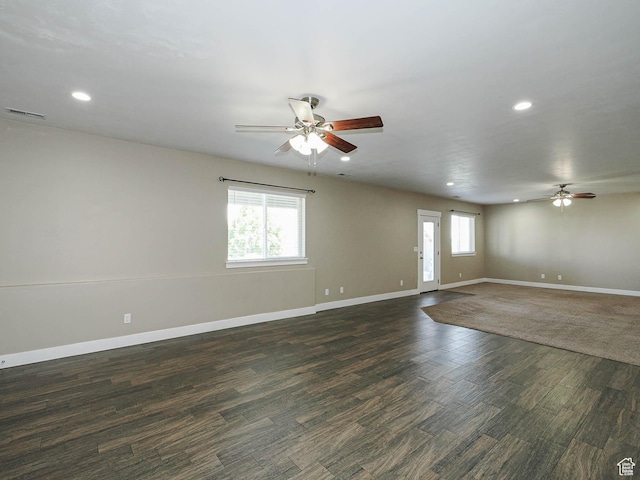 7503 S Bridge Maple Ln, West Jordan, UT 84081 - empty room with ceiling fan, recessed lighting, plenty of natural light, and dark wood-style flooring