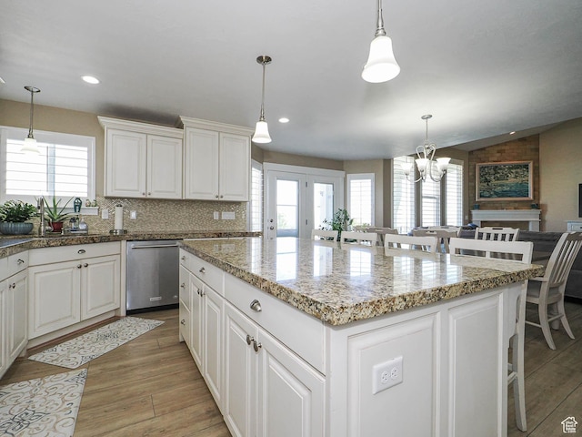 7503 S Bridge Maple Ln, West Jordan, UT 84081 - kitchen featuring plenty of natural light, stainless steel dishwasher, a center island, a chandelier, and recessed lighting
