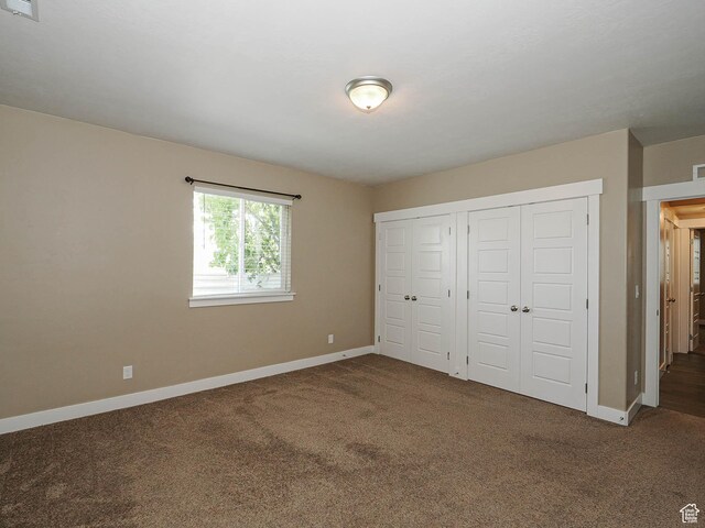 7503 S Bridge Maple Ln, West Jordan, UT 84081 - unfurnished bedroom featuring carpet, baseboards, and a closet
