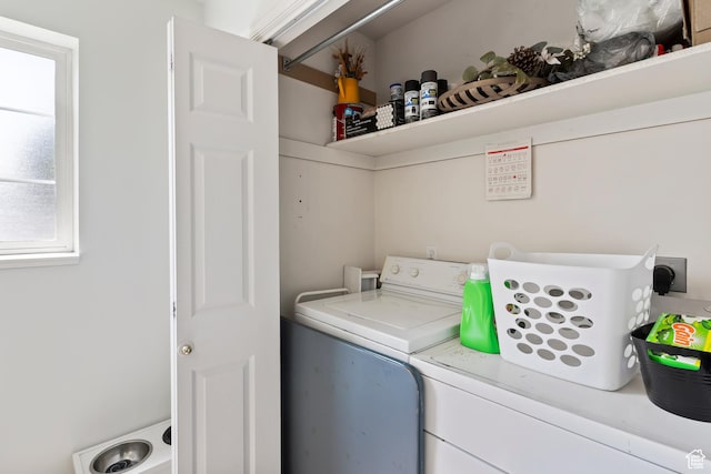 washroom with independent washer and dryer