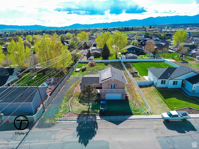 aerial view of residential area featuring a mountain backdrop