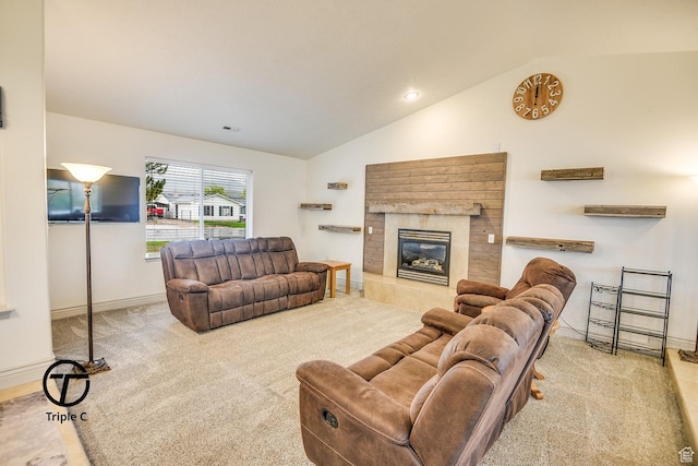 carpeted living area featuring vaulted ceiling, a fireplace, baseboards, and recessed lighting