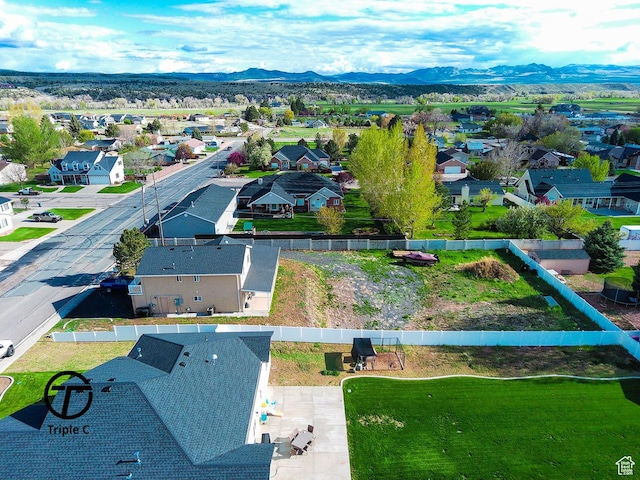 aerial view of residential area with mountains