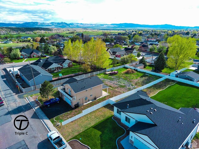 aerial view of residential area featuring a mountain backdrop