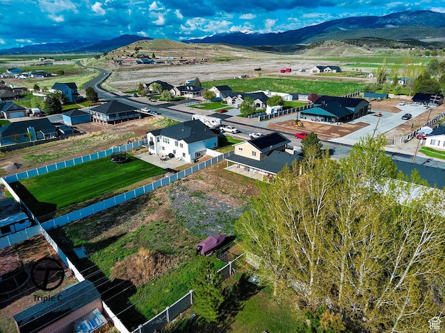 aerial perspective of suburban area with a mountainous background